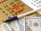 Variety of American money laid out under a stack of cash.Hundred US dollar bills. Selective focus.