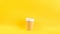 A variety of appearance and color cups for coffee, Bright yellow background. Cool funny video footage timelapse