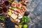 A variety of appetizer, prosciutto,grapes, wine, cheese with mold, figs, olives on a rustic background. Mediterranean snack.Top vi