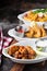 Variety of appetizers with fried shrimp and wings
