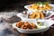 Variety of appetizers with fried shrimp and wings