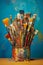 A variety of artist paint brushes laid out on a vibrant background, in art class extracurricular hobby at school or