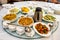 Variety asian food serving with tea preparing on glass round tab