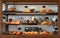 Variety baked bread and dessert in glass showcase at bakery