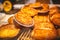 Variety of bakery products, sweet cakes, with cheese and breads. Close up of a bun bun with cheese on the counter in the store.