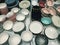 A variety of beautiful pottery dishes displayed for sale