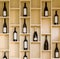 Variety bottles of wine and champagne in a wooden display case in the store