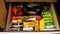 Variety brands of instant noodles stored in a drawer of kitchen cabinet