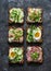 Variety breakfast, appetizer, tapas whole grain bread sandwiches with cream cheese, egg, asparagus, avocado, cucumber, shrimp,