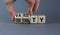 Variety or certainty symbol. Concept words Variety or certainty on wooden cubes. Businessman hand. Beautiful grey table grey