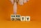 Variety or certainty symbol. Concept words Variety or certainty on wooden cubes. Businessman hand. Beautiful orange table orange