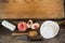 Variety of cheese with peach, spoon, knife and chopping board