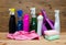 Variety cleaning supplies on wooden table and background