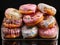 Variety of colorful donuts, freshly baked and adorned with glaze and sprinkles, are showcased in a tempting array