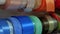 A variety of colorful ribbons on special stands in a flower shop