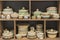 Variety of Colorfully Painted Ceramic Pots in an Outdoor Shopping Market. pottery in the shop window