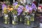 Variety of colors near the Liberty store in London. Large bouquets in tin vases. Pink roses