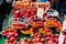 Variety of coloured bell peppers and other vegetable on display