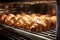A variety of delicious croissants neatly arranged on a rack, ready to be enjoyed, fresh croissants in rack in bakery oven, AI