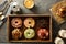 Variety of donuts in a wooden box