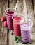 Variety of fresh berry smoothies in a row