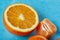 Variety of fresh citrus fruits for making juice or smoothie over blue textured background, top view, selective focus.