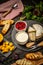 Variety of fresh food ingredients for Sweet berry crostini sandwiches with ricotta mango cranberry, rustic background, top view,