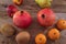 A variety of fresh fruit that lie on a wooden background