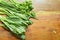 Variety fresh green vegetable arranged on wooden table