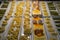 Variety of fresh pasta types showcase for dinner including pappardelle, ravioli, etc. on white rectangle plate at night