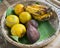 a variety of fruit lies on a wicker plate