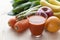 A variety of fruits and vegetables and a glass of vegetable juice