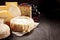 Variety of Gourmet Cheeses on Textured Surface