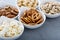 Variety of healthy snacks in white bowls