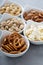 Variety of healthy snacks in white bowls