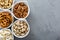 Variety of healthy snacks in white bowls