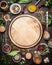 Variety of herbs and spices around empty cutting board on rustic wooden background, top view