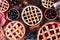 Variety of homemade fruit pies. Top view table scene over rustic wood.