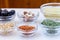 Variety of ingredients for couscous cooking in glass bowls