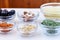 Variety of ingredients for couscous cooking in glass bowls