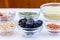 Variety of ingredients for couscous cooking in glass bowls