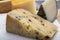 Variety of Italian pecorino cheeses, aged with black peppers from Nebrodi, white Il Palio and black molarotto, close up