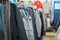 Variety of jackets, vests and sweaters on stands