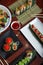 Variety of Japanese food dishes served on the restaurant table. Vertical image. Aerial view