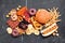 Variety of junk foods scattered over a dark background