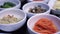 Variety of Korean small side dishes full table bbq meal