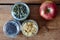 Variety of muesli with a fresh healthy apple