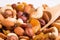 Variety nuts and raisins closeup. Nut mix and wooden spoon