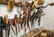 Variety of old vintage and modern household hand tools on a garage shelves in a DIY and renovations concept