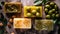 Variety of options handmade olive soaps with fresh olives and olive branch with leaves on wooden background top view. Spa, hygiene